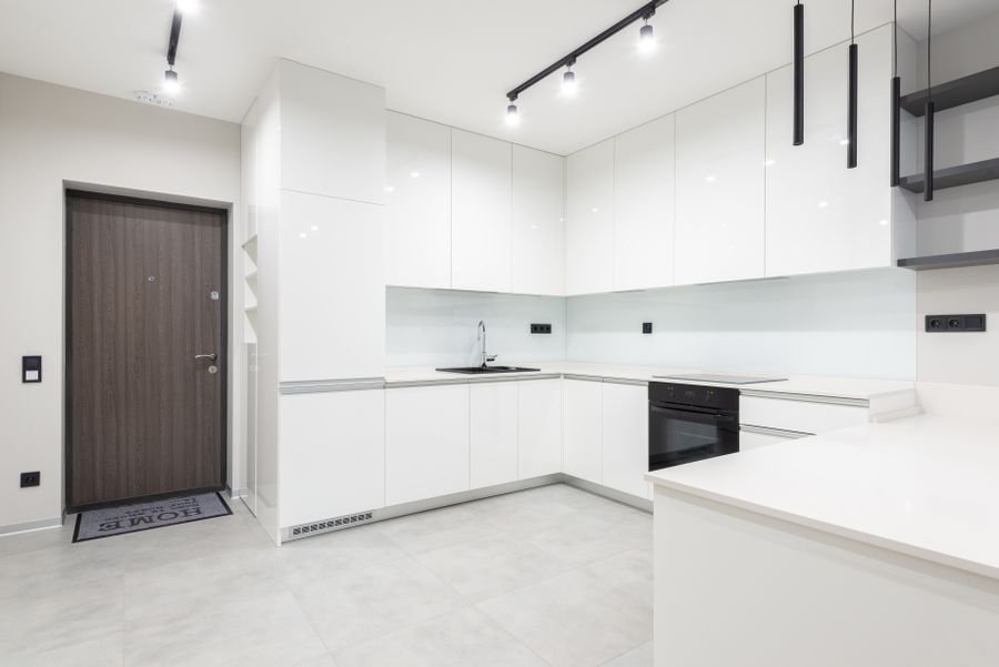 Spotless bright white modern kitchen with clean countertops